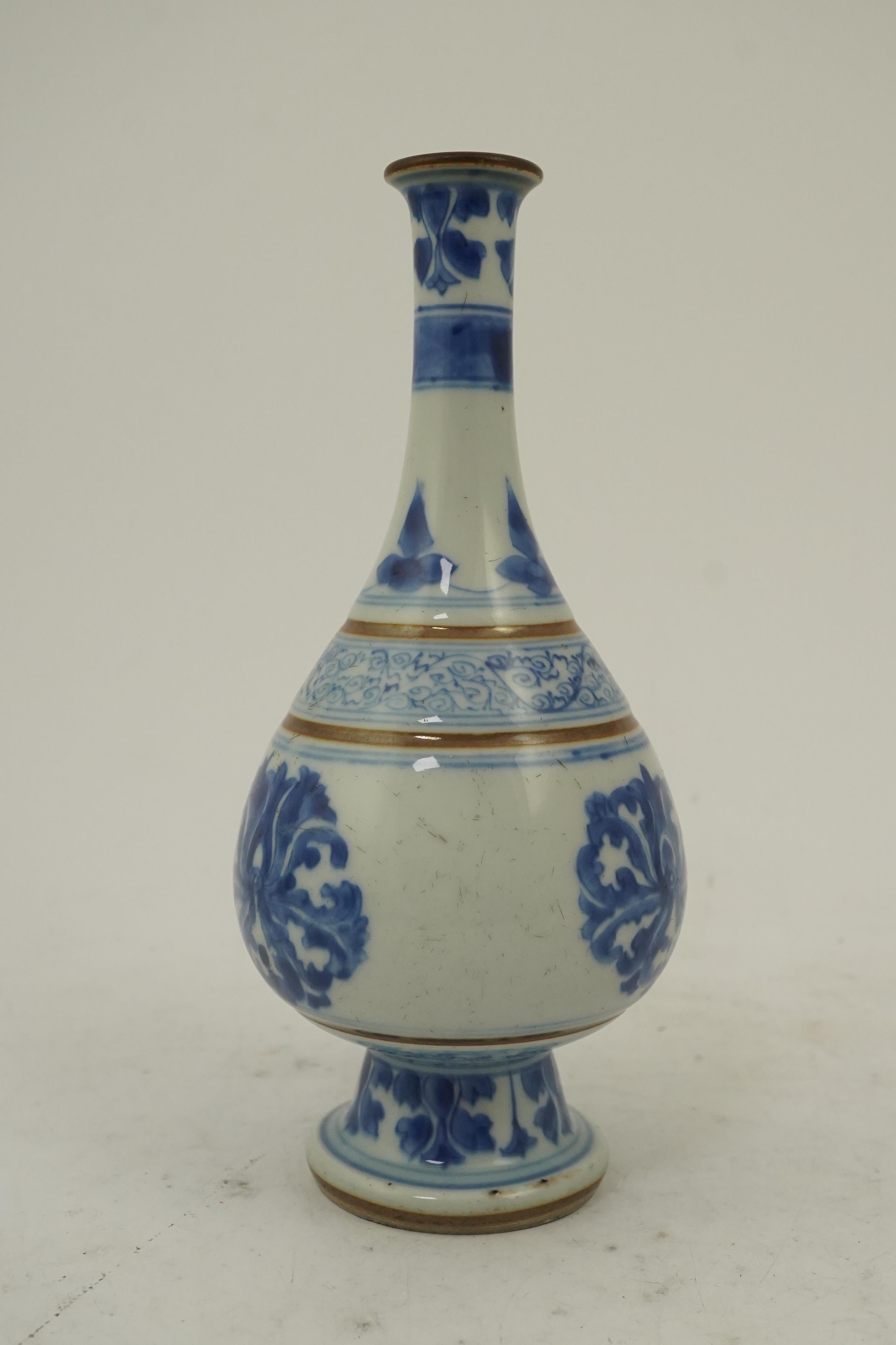 A Chinese blue and white ‘lotus’ bottle vase, Kangxi period